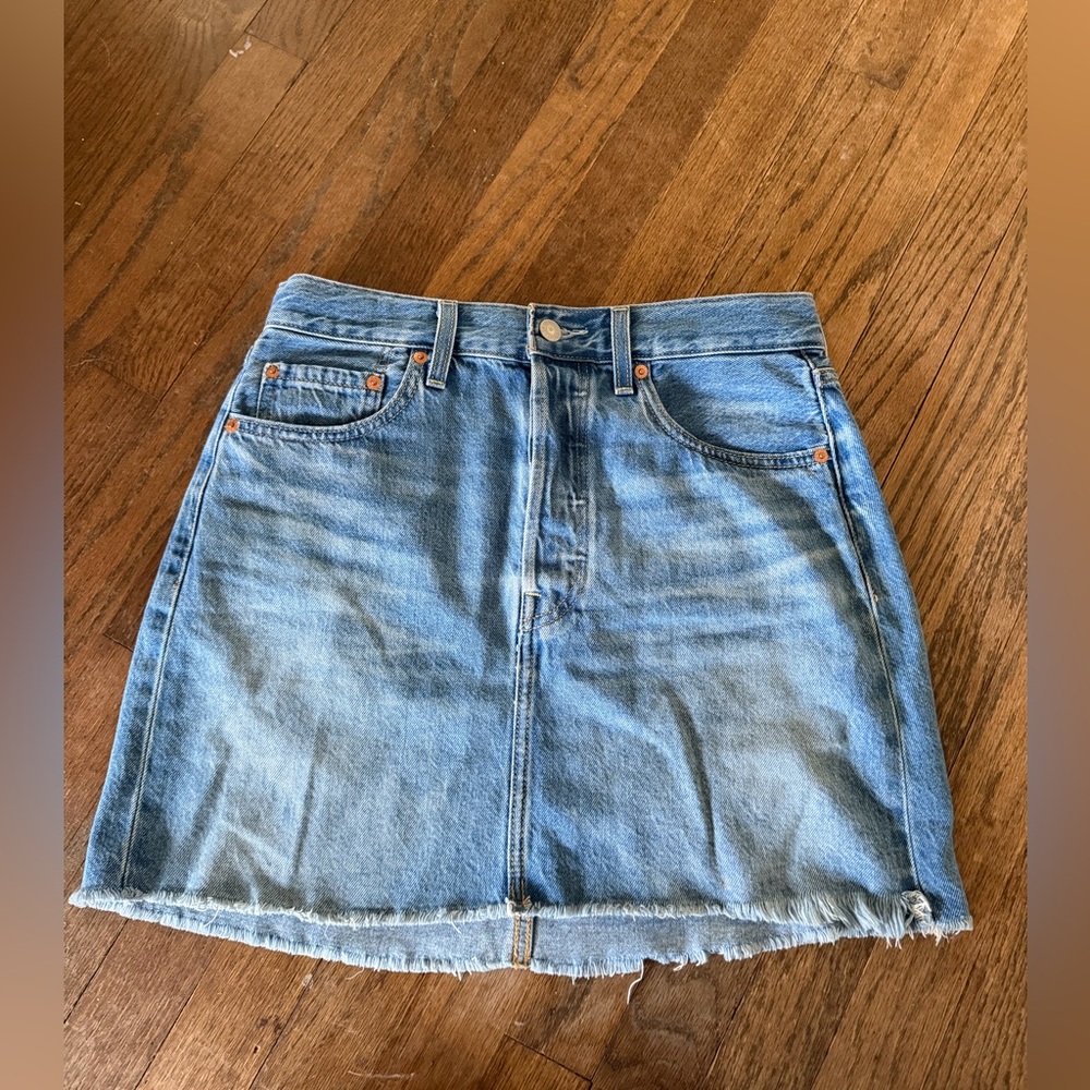 Levi's blue denim “ Rib Cage” mini skirt with frayed hem and button Size: 26”